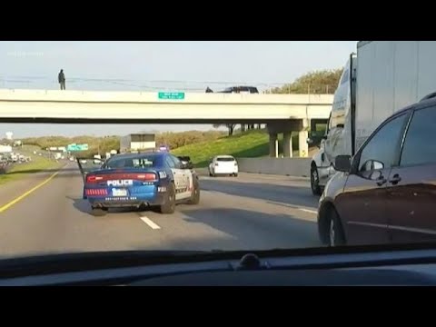 A teen was jumping from an overpass &ndash; so a cop enlisted the help of a big-rig driver