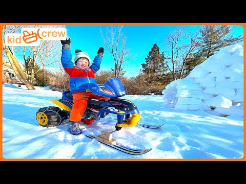 Driving Power Wheel snowmobile, awesome winter sledding track and snow igloo. Educational | Kid Crew