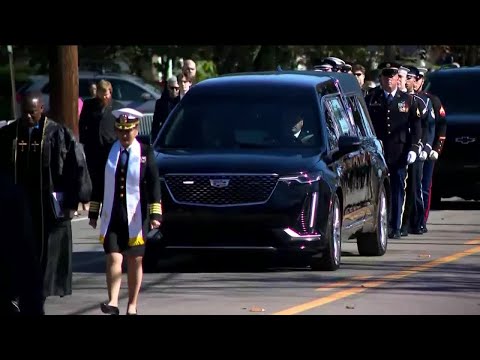 Rosalynn Carter is eulogized before family and friends as husband Jimmy bears silent witness