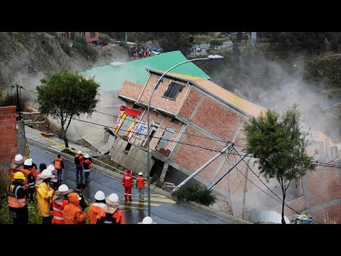 Bolivia: residents watch as landslide sweeps away houses