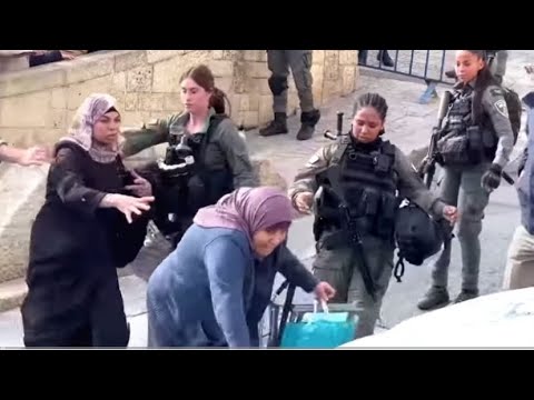 Israeli Forces bar Palestinians from Prayer and Push Elderly Woman down . 