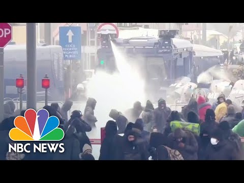 Poland Police Use Water Cannons Against Migrants