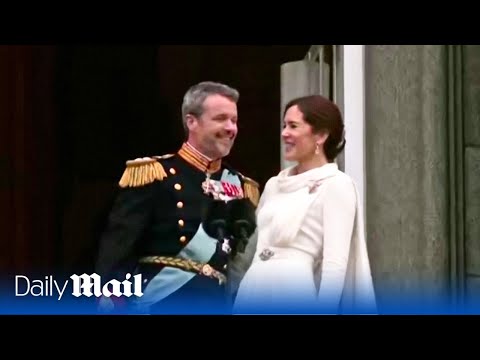 Sealed with a kiss! Denmark's new King Frederik is joined by Queen Mary in balcony appearance