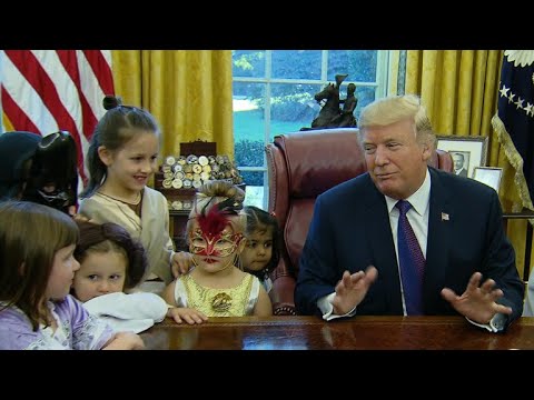 Trump gives treats to costumed kids in Oval Office for Halloween