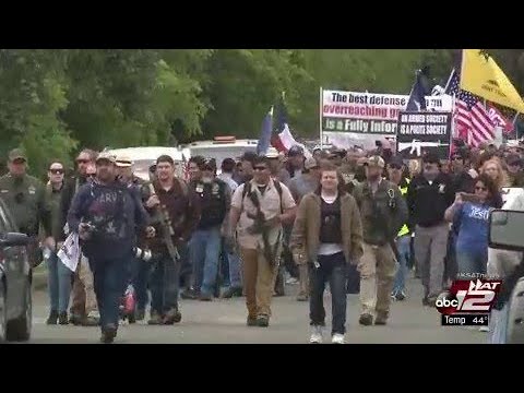 Gun activists protest through Olmos Park after weeks of confrontation with police