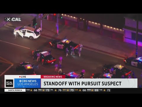 Stolen vehicle's tire ripped off by spike strip during lengthy pursuit with armed suspect