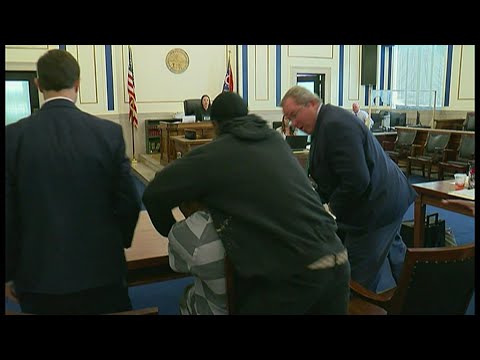 Father punches son's accused killer in Ohio court