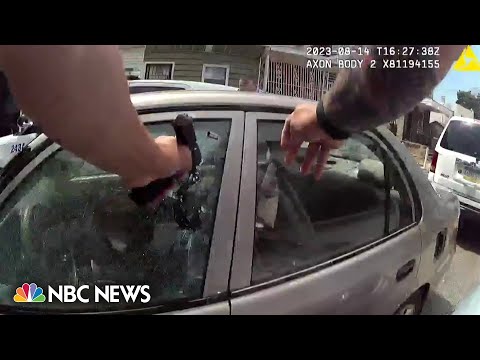 Philadelphia officer charged with murder after bodycam video shows him firing into car