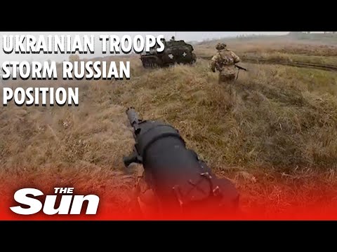 Ukrainian soldiers storm of Russian enemy positions with rifles