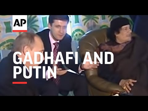 Gadhafi and Putin meet at fireside Bedouin tent