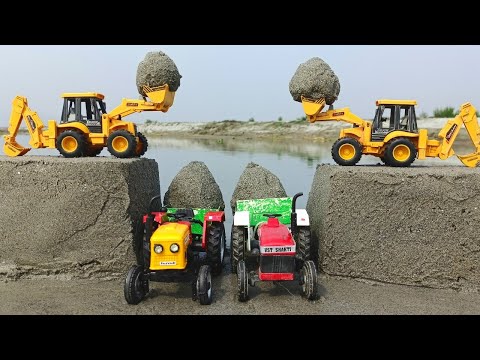 JCB 3dx and jcb4dx backhoe loading powertrac tractor and sonalika tractor trolley loading