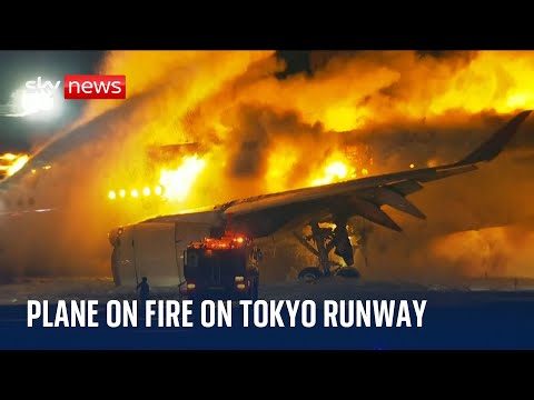 Plane in flames on runway of Tokyo airport