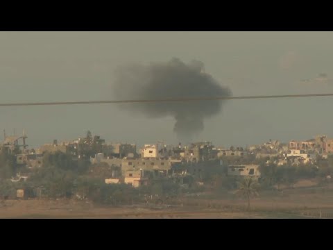 Plumes of smoke from explosions billow over morning Gaza sky