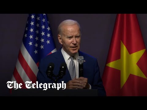 President Biden interrupted by White House staff at press conference in Vietnam