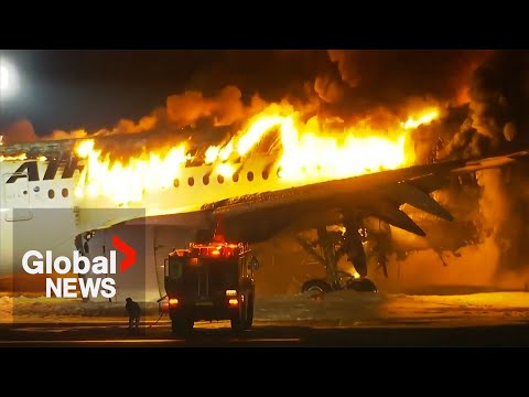 Japan Airlines plane bursts into flames in collision on runway with Coast Guard aircraft