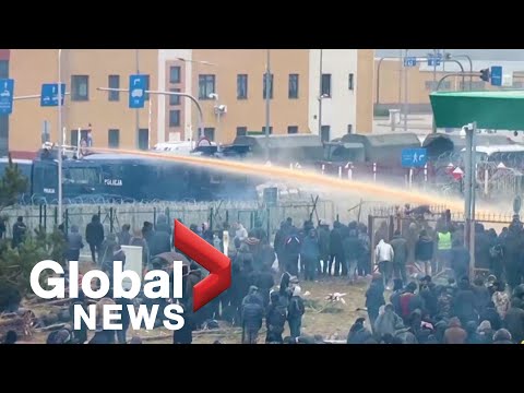 Poland turns water cannons on thousands of migrants as tensions rise at Belarus border