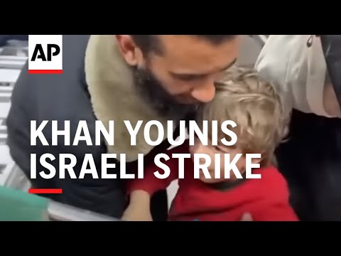 Boy clings to injured mother as wounded arrive at Khan Younis hospital after Israeli strike