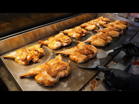 Crispy rice with grilled chicken on an iron plate - korean street food