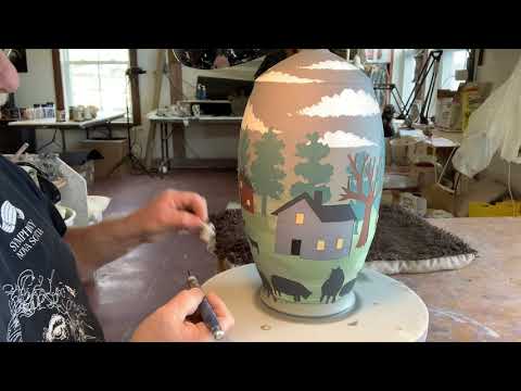 Under glaze painting of a lamp base