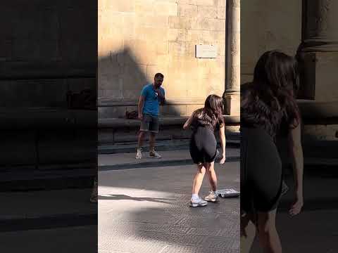 An opera singer beautifully singing O Sole Mio in the streets of Florence, Italy