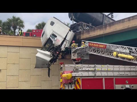 Driver Gets Emotional as He&rsquo;s Rescued From Dangling 18-Wheeler