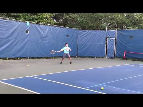 9 year old hitting Yellow tennis balls