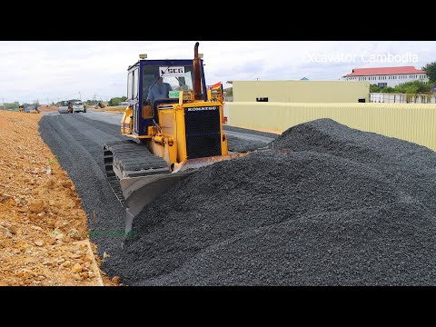 Bulldozer Spreading Gravel Building Foundation New Big Road And Dump Truck Unloading Gravel ...