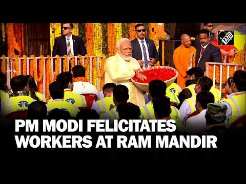 PM Modi felicitates workers at Ram Mandir, showers flower petals on them