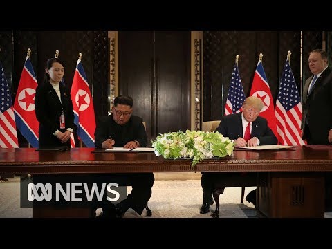 Donald Trump and Kim Jong-un sign document after summit