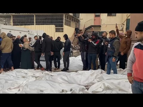 Covered bodies lie outside hospital in central Gaza, most from strike on Maghazi refugee camp