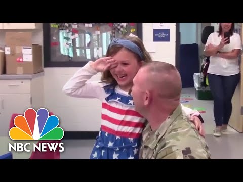 Watch: Two military parents surprise their daughters during school