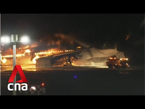 Japan Airlines plane on fire at Tokyo's Haneda airport after colliding with coast guard aircraft