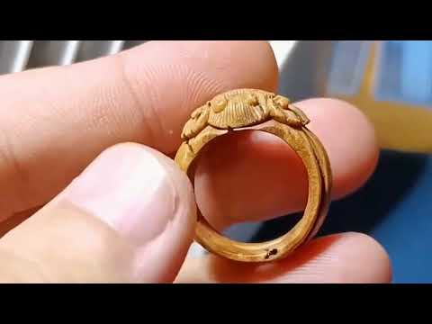 Unbelievable! This exquisite ring is actually carved from peach pit | wood carving