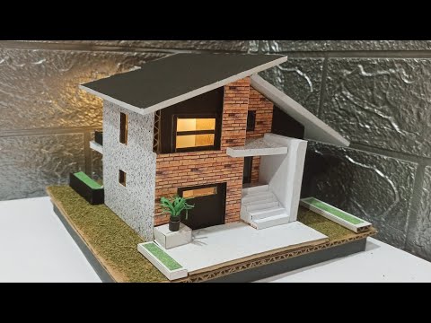 miniatur rumah dari kardus. 