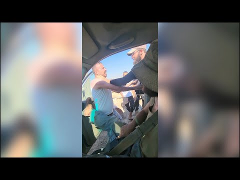 Israeli settlers who invaded Palestinian land bully its owner and attack him in front of soldiers