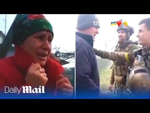 Ukrainian citizens hug troops after they liberated village that was occupied by Russian forces