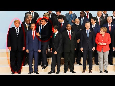 Emmanuel Macron jostles his way to the front of G20 photo to stand by Donald Trump