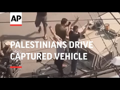 Celebrations as Palestinians drive captured Israeli military vehicle into Gaza City