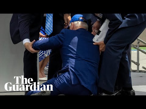 Joe Biden falls on stage at US air force academy ceremony