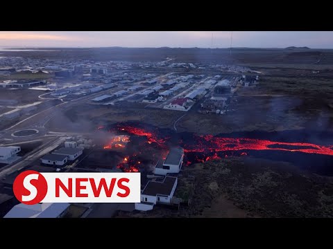 Drone footage shows molten lava burning houses in Iceland