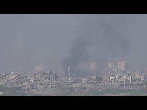 Explosions, plumes of smoke, Israeli military vehicles in northern Gaza Strip