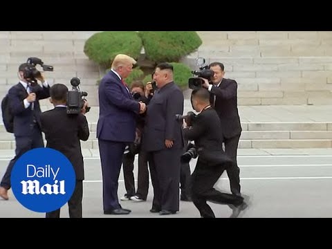 Moment Trump steps into North Korea to meet Kim Jong-un