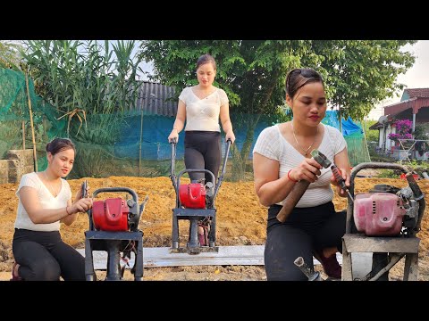 A genius girl repairs a soil compactor for her neighbor