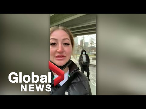 Woman records on her phone as strange man stalks her through downtown Vancouver