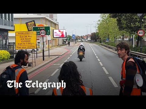 Moment motorcyclist rams past Just Stop Oil protesters blocking the road