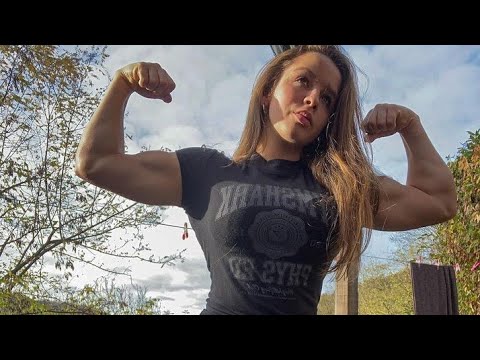 Gorgeous muscular woman flexing biceps