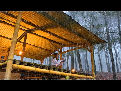 Tiny girl alone in OFF-GRID bamboo shelter in heavy rain. COZY WARM bamboo cabin in wild rain forest