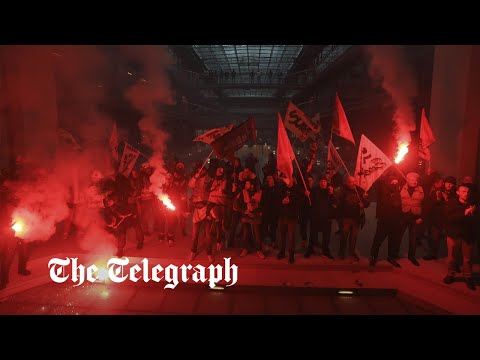 French protesters with flares storm BlackRock offices in Paris