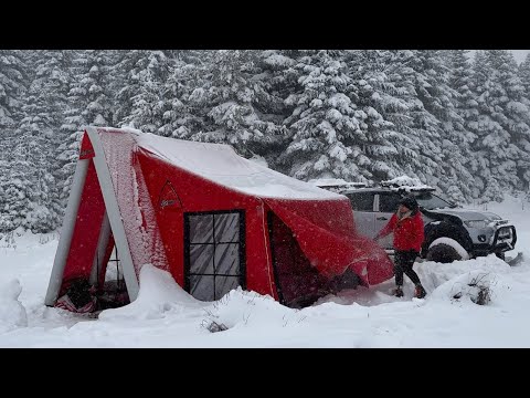 OUR TENT WAS COVERED IN SNOW DURING THE SNOWSTORM