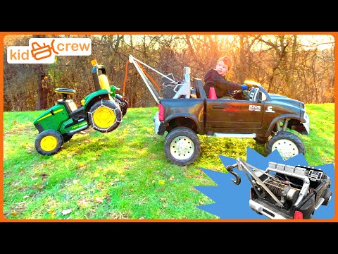 Tow truck rescue with kids ride on toy truck and tractor. Educational how winches work | Kid Crew